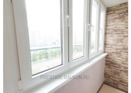 Тёплое остекление балкона профилем КВЕ и комбинированной отделкой пластиком и деревом в Люберцах