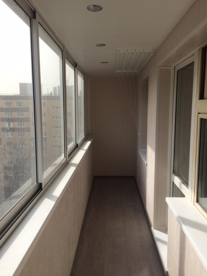 Теплое остекление балкона профилем KBE и установка сушилки в Люберцах